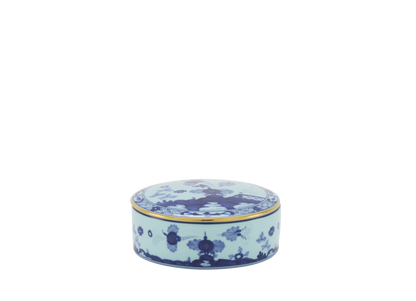 Round porcelain trinket box with a cover, featuring blue Garofano (Carnation) motif contrasted against an Iris blue background with gold threading.