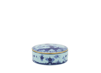 Round porcelain trinket box with a cover, featuring blue Garofano (Carnation) motif contrasted against an Iris blue background with gold threading.