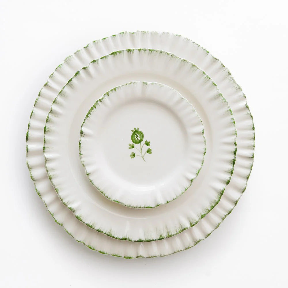 Set of 2 Ruffled Green Dinner Plates with soft green edging and a unique ruffled rim. Handmade from 100% ceramic, these plates are microwave and dishwasher safe. Each plate measures 10.5" in diameter. Made in Portugal.