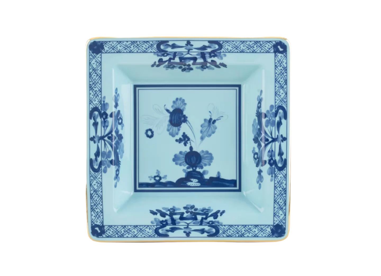 Iris square change tray in porcelain with gold threading from the Oriente Italiano collection. Features a blue carnation floral motif on iris blue porcelain with gold threading along the Antico Doccia shape.