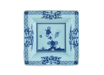 Iris square change tray in porcelain with gold threading from the Oriente Italiano collection. Features a blue carnation floral motif on iris blue porcelain with gold threading along the Antico Doccia shape.