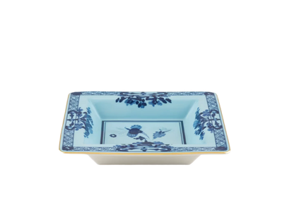 Iris square change tray in porcelain with gold threading from the Oriente Italiano collection. Features a blue carnation floral motif on iris blue porcelain with gold threading along the Antico Doccia shape.