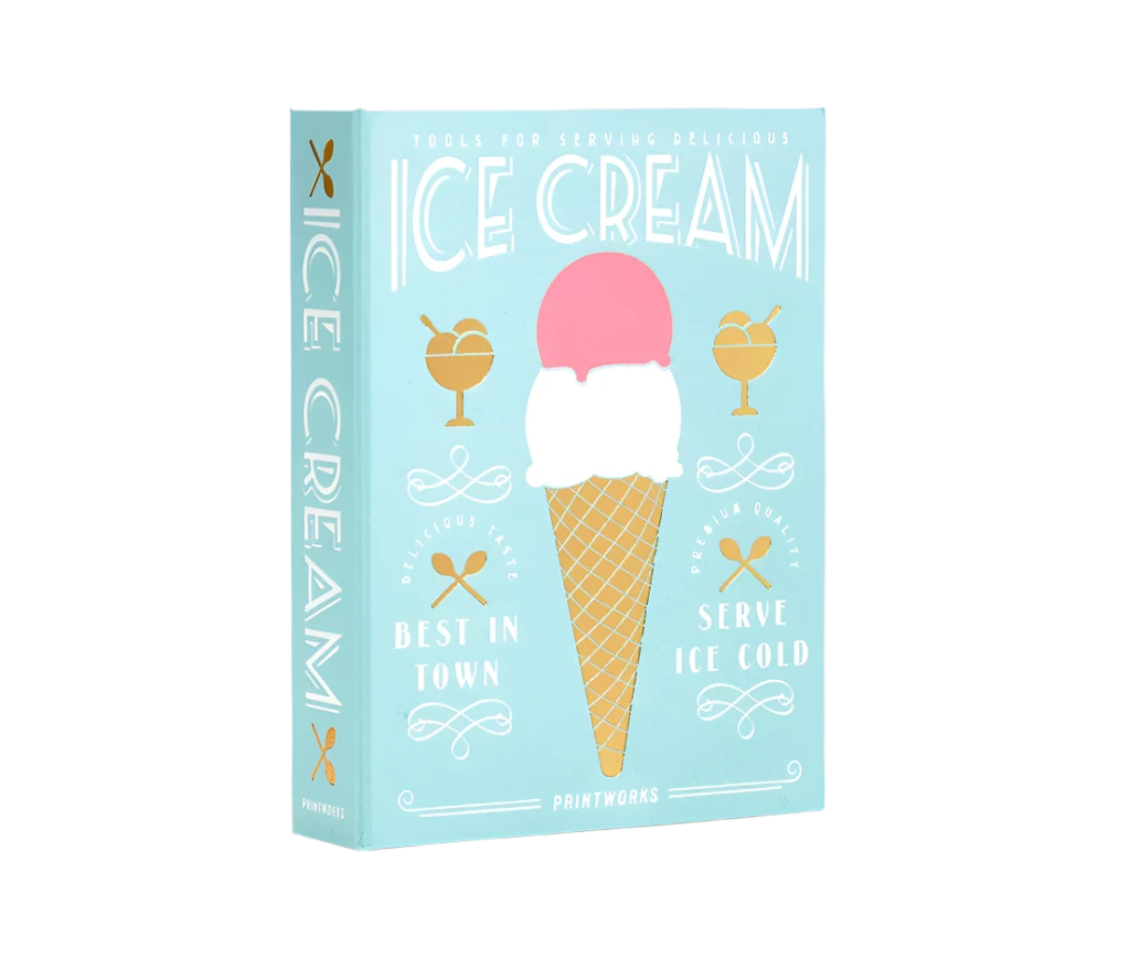 Essential Ice Cream Kit in an elegant book-like box, containing 2 cone shapes, an ice cream scoop, and 2 sprinkle scoops, all made of stainless steel and dishwasher safe. Perfect for hosting ice cream parties.