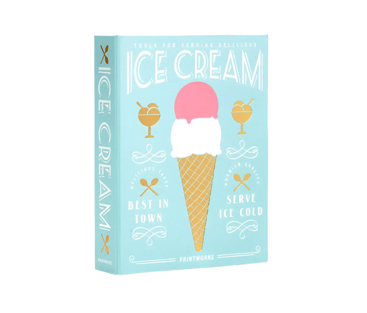 Essential Ice Cream Kit in an elegant book-like box, containing 2 cone shapes, an ice cream scoop, and 2 sprinkle scoops, all made of stainless steel and dishwasher safe. Perfect for hosting ice cream parties.