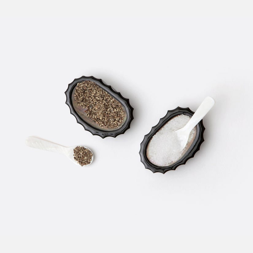 Tilda Pinch Bowls, set of 4, made from ridged black resin with abalone shell accents. Includes miniature serving spoons, each set unique. Easy to clean, avoid water for best care.