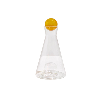 Clear and amber Vice Versa Carafe with a sculptural sphere that can rest in the glass-blown mouth or base, perfect as a centerpiece or stylish serving vessel.