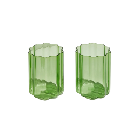 Set of two green Wave Glasses with a rippled design, adding a playful yet elegant touch to any drink or occasion.