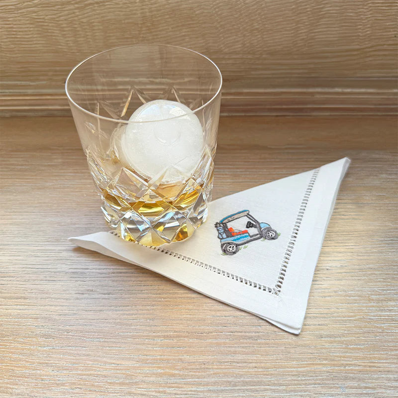 Hand-embroidered Golf Cocktail Napkins, designed in Portland, Oregon. Meticulously crafted from cotton by expert artisans, these elegant napkins are perfect for daily use and entertaining, adding a touch of sophistication to your table.